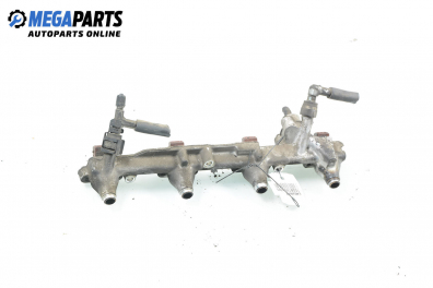 Fuel rail with injectors for Ford Mondeo Mk II 2.0, 131 hp, sedan, 5 doors, 1996