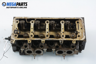 Cylinder head no camshaft included for Peugeot 306 1.4, 75 hp, station wagon, 1999