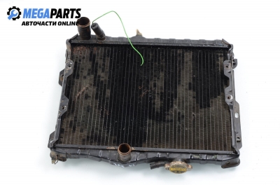 Water radiator for Mitsubishi Lancer 1.5, 90 hp, station wagon, 1989